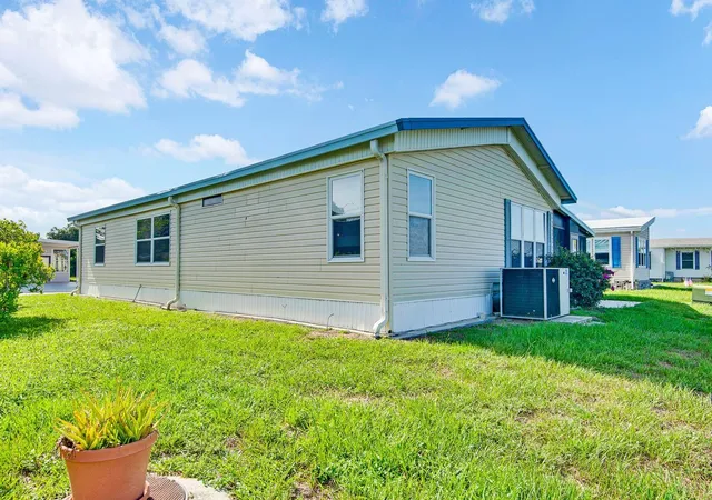 Photo 3 of Manufactured home for sale at 9107 34th Avenue E, Palmetto, FL 34221 | MLS# A4700429 | Listing updated on 2026-09-06