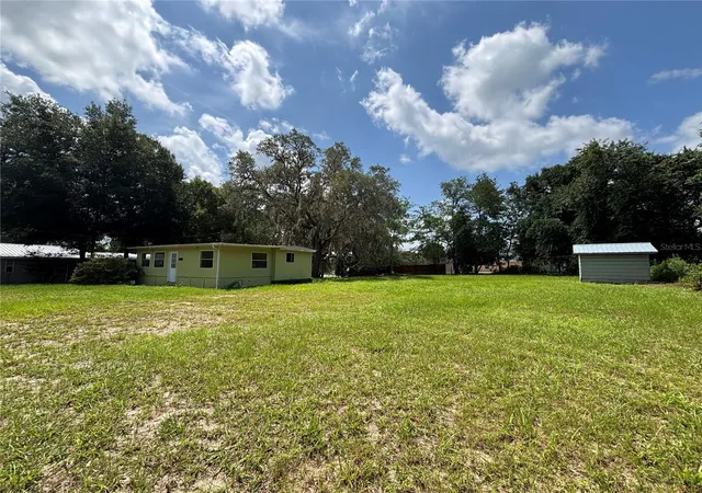 Photo 3 of Manufactured home for sale at 18274 SE 22nd Place, Silver Springs, FL 34488 | MLS# OM728850 | Listing updated on 2026-09-25