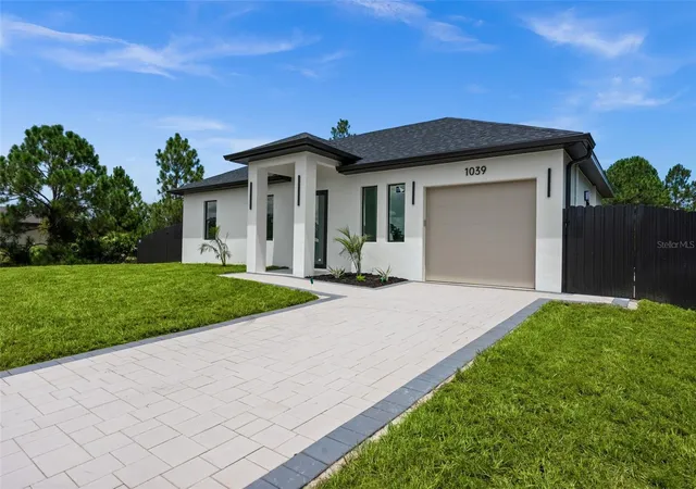 Photo 3 of Single family home for sale at 1039 Bassinger Ave S, Lehigh Acres, FL 33974 | MLS# TB8536542 | Listing updated on 2026-08-17