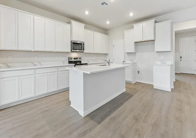 Photo 3 of Single family home for sale at 10436 Woodland Garden Way, Parrish, FL 34219 | MLS# A4702287 | Listing updated on 2026-09-02