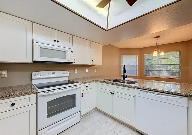 Photo 4 of Single family home for sale at 7308 Baltusrol Dr, New Port Richey, FL 34654 | MLS# W7888585 | Listing updated on 2026-10-14