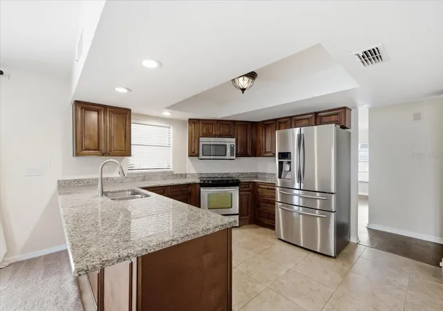 Photo 4 of Single family home for sale at 14105 Knottingsley Pl, Tampa, FL 33624 | MLS# TB8538926 | Listing updated on 2026-10-03
