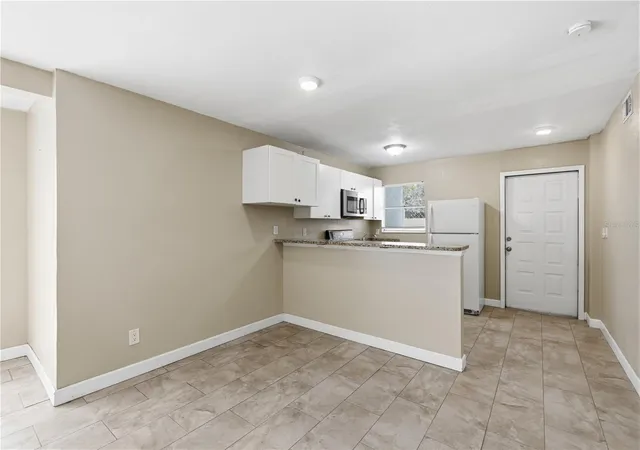 Photo 3 of House for sale at 1009 E Holland Ave, Tampa, FL 33612 | MLS# TB8538995 | Listing updated on 2026-08-27