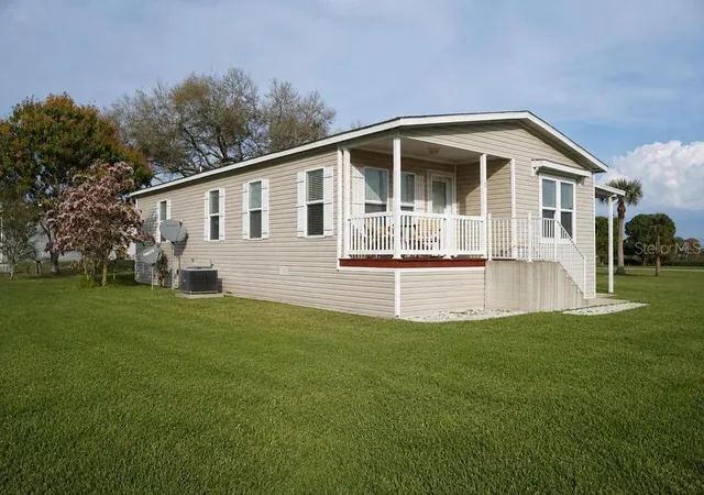 Photo 2 of Manufactured home for sale at 56 Manor Dr, Fort Pierce, FL 34982 | MLS# K4903713 | Listing updated on 2026-09-04