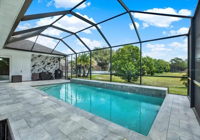 Photo 2 of Single family home for sale at 690 Sudbrook Ln, Spring Hill, FL 34609 | MLS# W7888706 | Listing updated on 2026-08-24