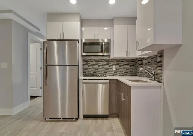 Photo 1 of Multi family home for sale at 55 Wayne St, Jersey City, NJ 07302 | MLS# 26027702 | Listing updated on 2026-07-22