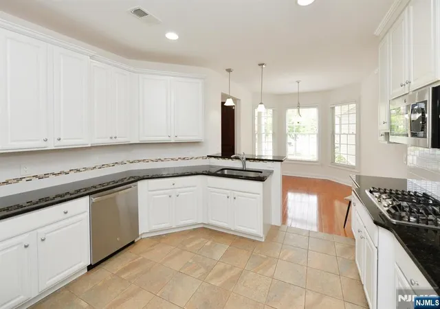 Photo 4 of Townhouse for sale at 99 Windsor Ln, Ramsey, NJ 07446 | MLS# 26029980 | Listing updated on 2026-10-04