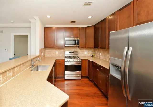Photo 2 of Condo for sale at 54 Polifly Rd #409, Hackensack, NJ 07601 | MLS# 26030765 | Listing updated on 2026-08-19