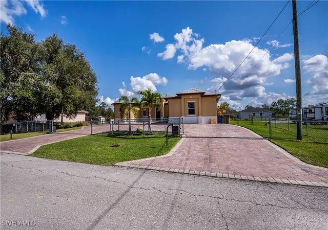 1st image of 802 Poinsettia Ave, Lehigh Acres, FL 33972 | MLS# 225011100