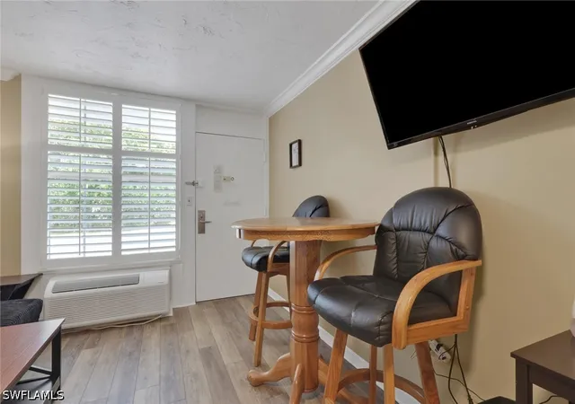 Listing Photo 4 - Condo for sale in building located at 2555 Tamiami Trl N, Naples, FL 34103 - Unit #115