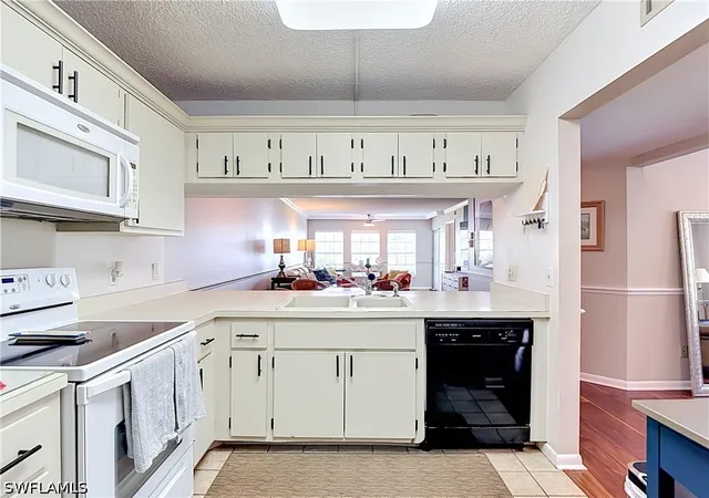 Listing Photo 5 - Condo for sale in building located at 1708 Kings Lake Blvd, Naples, FL 34112 - Unit #5-106