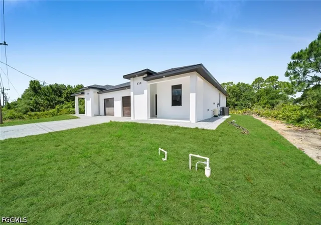 Photo 2 of Sale Pending at 330 / 332 Bell Blvd S, Lehigh Acres, FL 33974 | MLS# 2026022499 | Listing updated on 2026-08-29