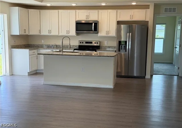 Photo 3 of Single family home for sale at 557 Oakshire Ln, Lehigh Acres, FL 33972 | MLS# 2026029266 | Listing updated on 2026-08-28