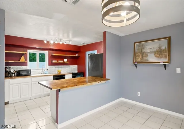 Photo 3 of Single family home for sale at 301 Hollywood St, Lehigh Acres, FL 33936 | MLS# 2026030561 | Listing updated on 2026-08-16