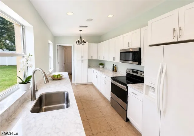 Photo 3 of Single family home for sale at 416 Candlewick Cir S, Lehigh Acres, FL 33936 | MLS# 2026031693 | Listing updated on 2026-08-18