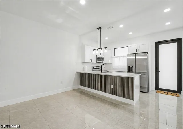 Listing Photo 4 - Condo for sale in building located at 873 Eisenhower Blvd, Lehigh Acres, FL 33974