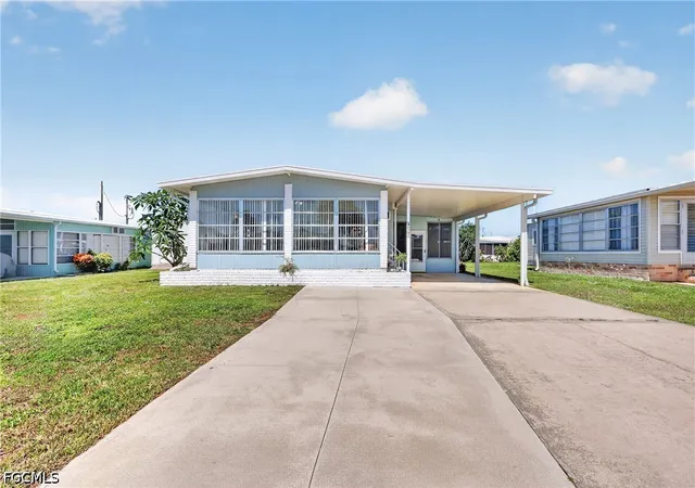 Photo 1 of Manufactured home for sale at 557 Peace Lake Ct, North Fort Myers, FL 33917 | MLS# 2026033844 | Listing updated on 2026-08-17