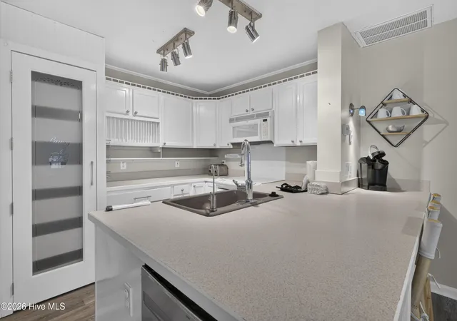 Photo 3 of Townhouse for sale at 329 S 5th Avenue #B, Kure Beach, NC 28449 | MLS# 100589829 | Listing updated on 2026-08-19