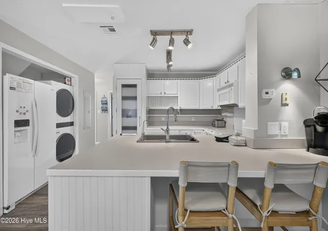Photo 4 of Townhouse for sale at 329 S 5th Avenue #B, Kure Beach, NC 28449 | MLS# 100589829 | Listing updated on 2026-08-19