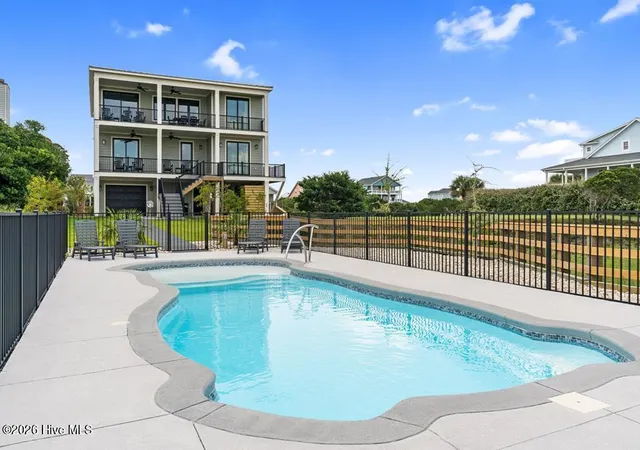 Photo 3 of Single family home for sale at 6620 Kings Lynn Dr, Oak Island, NC 28465 | MLS# 100598262 | Listing updated on 2026-09-29