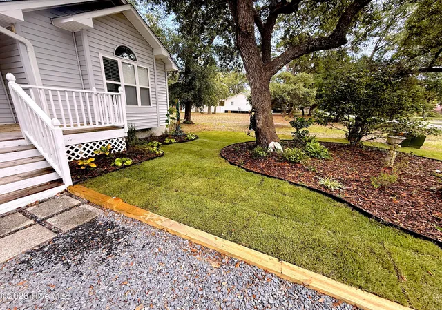 Photo 2 of Single family home for sale at 124 Nw 8th Street, Oak Island, NC 28465 | MLS# 100591343 | Listing updated on 2026-09-02