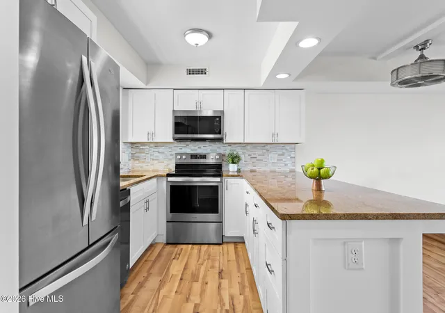Photo 4 of Townhouse for sale at 1403 Canal Dr # 10, Carolina Beach, NC 28428 | MLS# 100598877 | Listing updated on 2026-09-14
