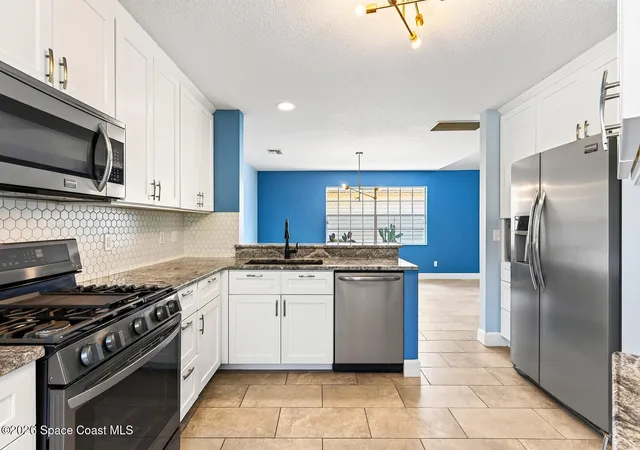 Photo 4 of Single family home for sale at 1599 Pga Blvd, Melbourne, FL 32935 | MLS# 1075190 | Listing updated on 2026-09-10