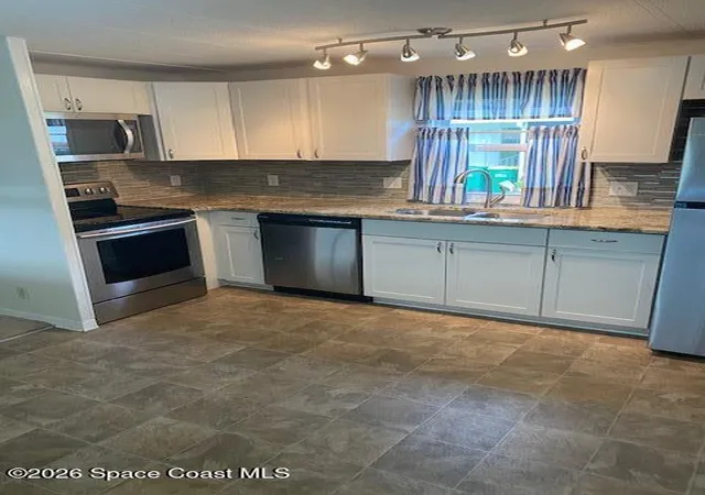 Photo 4 of Manufactured home for sale at 570 Marnie Cir, Melbourne, FL 32904 | MLS# 1084338 | Listing updated on 2026-08-25