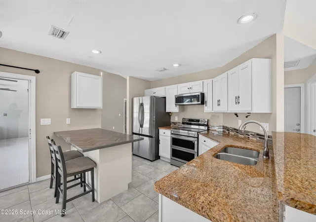 Photo 2 of Single family home for sale at 772 Americana Blvd Ne, Palm Bay, FL 32907 | MLS# 1085274 | Listing updated on 2026-09-02