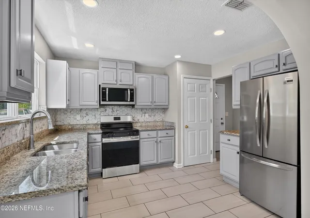 Photo 2 of Single family home for sale at 7015 Miss Muffet Ln N, Jacksonville, FL 32210 | MLS# 2156718 | Listing updated on 2026-09-16