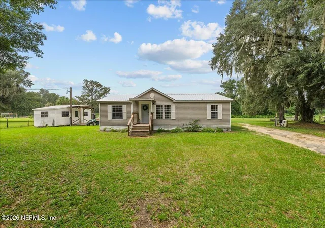 Photo 1 of Manufactured home for sale at 703 Walker Dr, Interlachen, FL 32148 | MLS# 2159598 | Listing updated on 2026-08-12