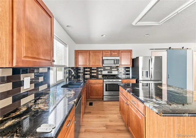Photo 2 of Single family home for sale at 5565 Jericho Ct, Denver, CO 80249 | MLS# 9442034 | Listing updated on 2026-10-07