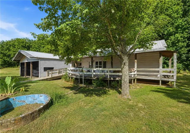 Photo 3 of Single family home for sale at 14047 Rocky Dell Holw Rd, Gravette, AR 72736 | MLS# 1359182 | Listing updated on 2026-08-21
