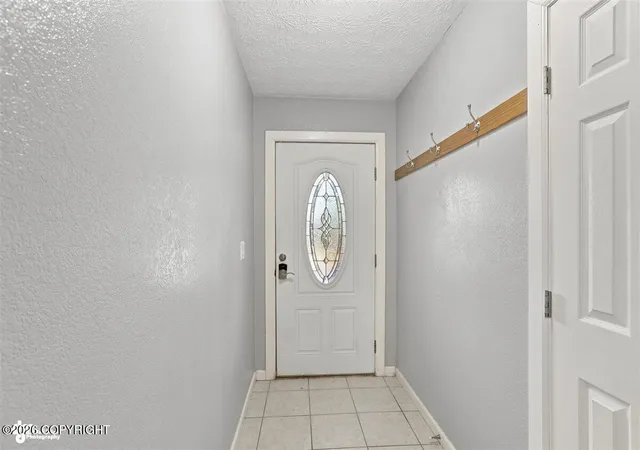Photo 3 of Single family home for sale at 1839 Bellevue Loop, Anchorage, AK 99515 | MLS# 26-8259 | Listing updated on 2026-10-08