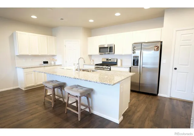 Photo 3 of Townhouse for sale at 6673 N Ceylon St, Denver, CO 80249 | MLS# IR1063925 | Listing updated on 2026-09-17