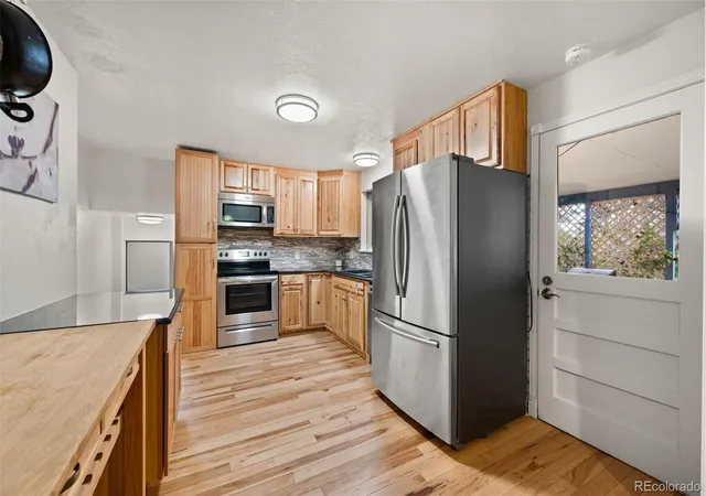 Photo 3 of Single family home for sale at 8301 Chase Dr, Arvada, CO 80003 | MLS# 2455642 | Listing updated on 2026-09-09