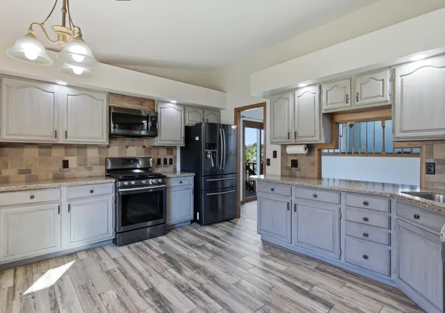 Photo 2 of Single family home for sale at 4002 Oak Knoll Dr, Eau Claire, WI 54701 | MLS# 7134054 | Listing updated on 2026-09-14
