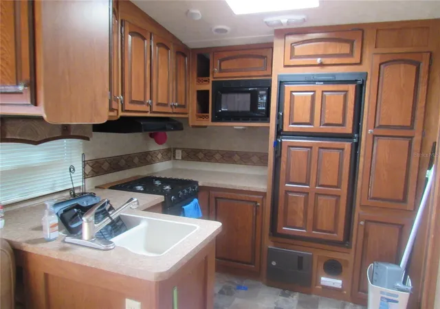 Photo 3 of Manufactured home for sale at 1950 SE 185th Terrace, Silver Springs, FL 34488 | MLS# OM710226 | Listing updated on 2026-09-25