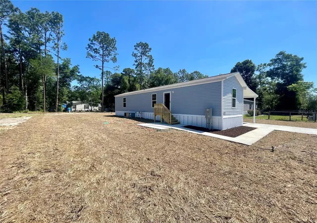 Photo 2 of Manufactured home for sale at 11355 NW 12th Lane, Ocala, FL 34482 | MLS# OM724289 | Listing updated on 2026-09-17