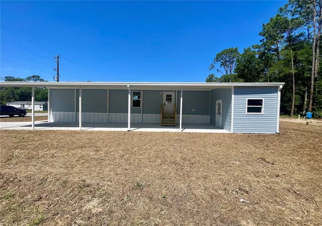 Photo 3 of Manufactured home for sale at 11355 NW 12th Lane, Ocala, FL 34482 | MLS# OM724289 | Listing updated on 2026-09-17