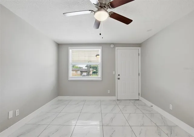 Photo 3 of Single family home for sale at 6033 W Amelia St, Orlando, FL 32835 | MLS# O6408294 | Listing updated on 2026-10-02