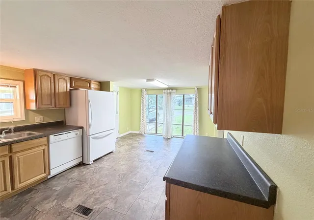 Photo 3 of Manufactured home for sale at 14224 Sandhurst St, Brooksville, FL 34613 | MLS# W7887146 | Listing updated on 2026-09-16