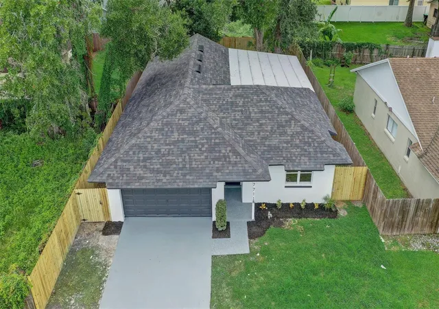 Photo 2 of Single family home for sale at 7711 Lakeside Woods Dr, Orlando, FL 32810 | MLS# O6432478 | Listing updated on 2026-09-16