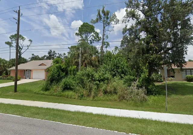 Photo 1 of Land for sale at 21086 Peachland Blvd, Port Charlotte, FL 33954 | MLS# C7501551 | Listing updated on 2026-02-18