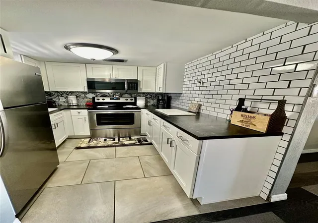 Listing Photo 4 - Condo for sale in building located at 5207 Turquoise Ln, New Port Richey, FL 34652 - Unit #202