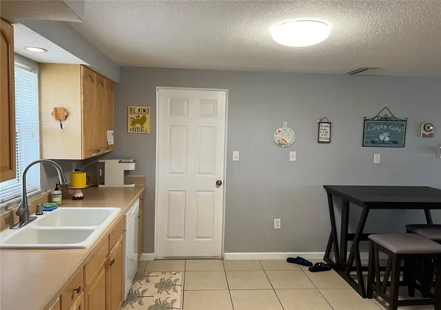Photo 2 of Single family home for sale at 705 Crestview Cir NW, Port Charlotte, FL 33948 | MLS# C7507930 | Listing updated on 2026-01-09