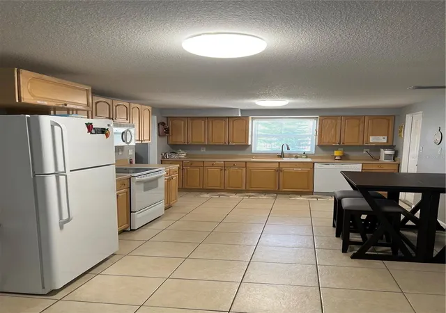 Photo 4 of Single family home for sale at 705 Crestview Cir NW, Port Charlotte, FL 33948 | MLS# C7507930 | Listing updated on 2026-01-09