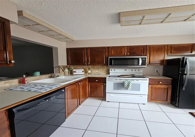 Photo 3 of Condo for sale at 13813 Mission Oaks Blvd, Seminole, FL 33776 | MLS# TB8372105 | Listing updated on 2026-10-05
