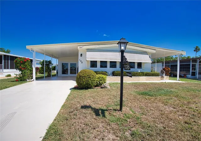 Photo 3 of Manufactured home for sale at 108 La Paloma, North Port, FL 34287 | MLS# TB8373530 | Listing updated on 2026-09-23