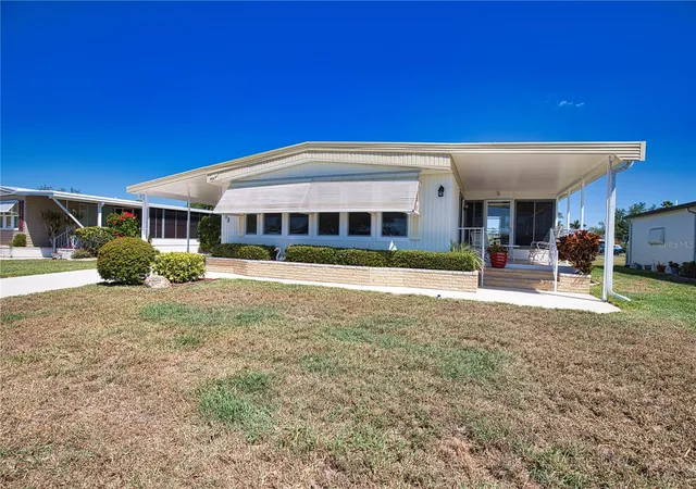 Photo 3 of Manufactured home for sale at 108 La Paloma, North Port, FL 34287 | MLS# TB8373530 | Listing updated on 2026-09-23